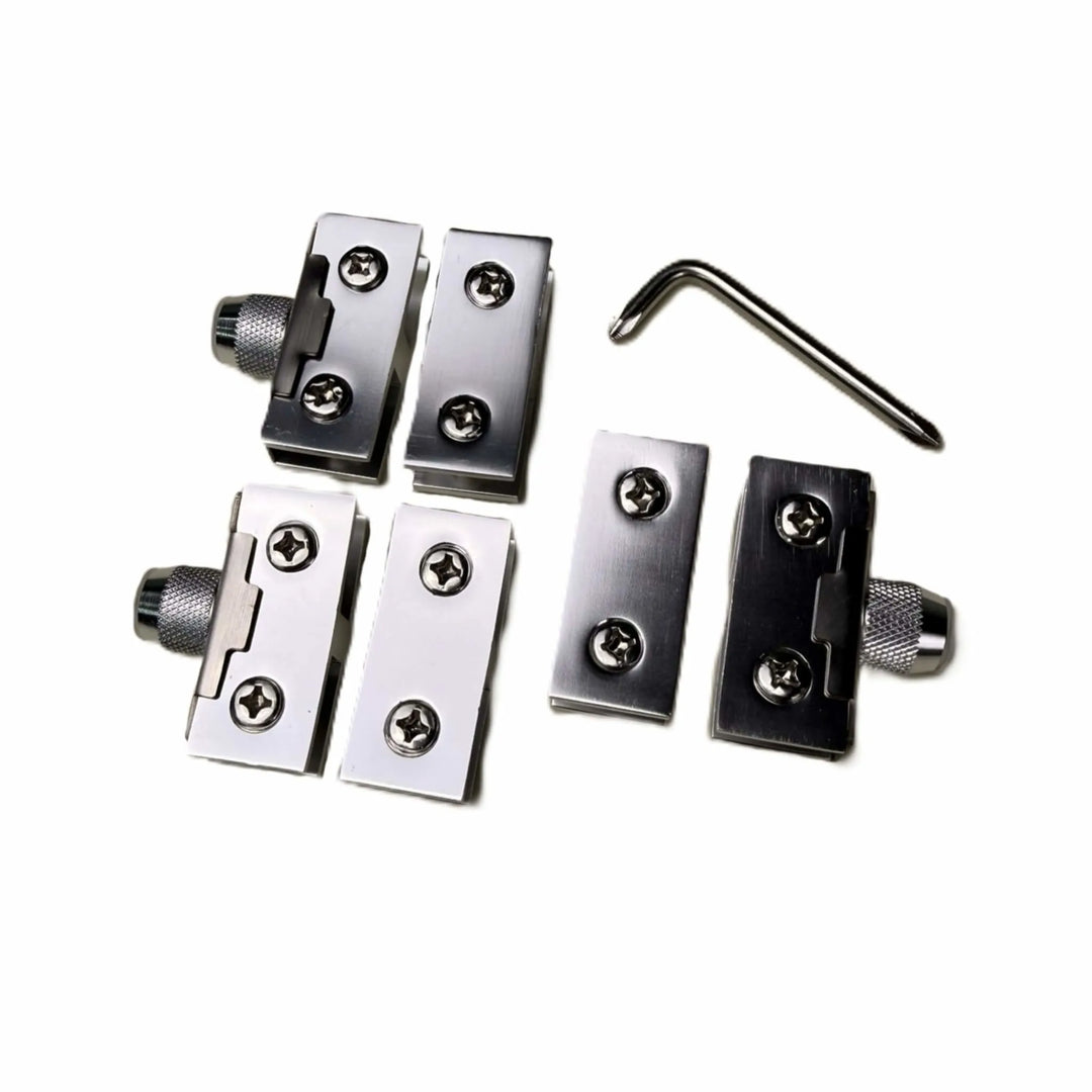 Top-down view of the Starfire Designs Béton Fire Pit Round Glass Guard Clips Kit featuring precision-cut stainless steel clips, mounting screws, and a tightening wrench for easy setup.