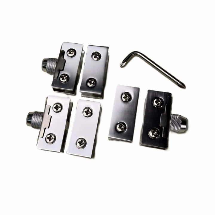 Top-down view of the Starfire Designs Béton Fire Pit Round Glass Guard Clips Kit featuring precision-cut stainless steel clips, mounting screws, and a tightening wrench for easy setup.