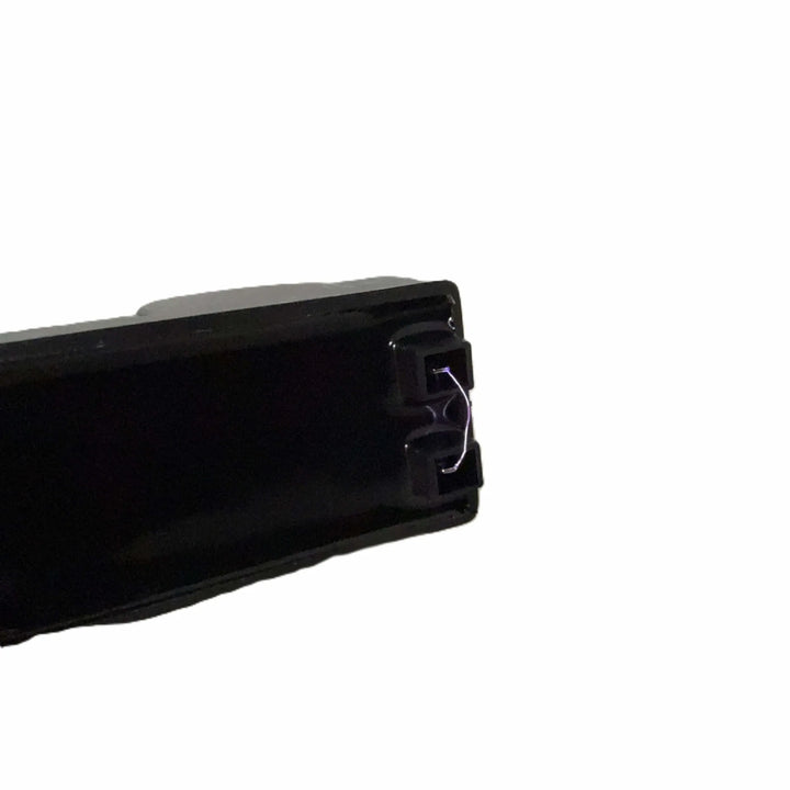 Close-up of the Starfire Designs Béton Fire Pit Spark Button showing the visible electric spark arc, demonstrating the igniter’s reliable flame-starting performance.