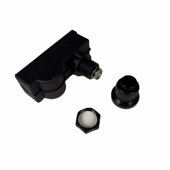 Starfire Designs Béton Fire Pit Replacement Spark Button disassembled to display the spring mechanism, threaded housing, and removable ignition cap components.