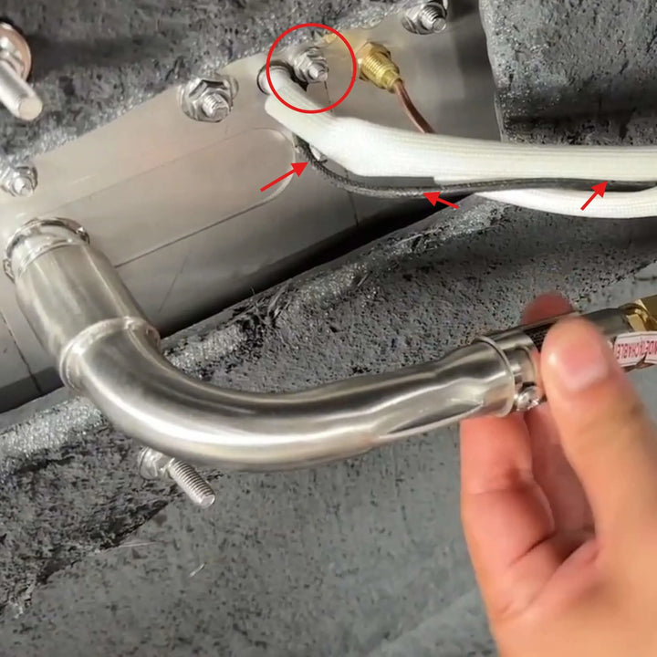 Starfire Designs Béton Fire Pit Replacement Spark Ground Wire installed beneath the burner assembly, connecting to ignition components for proper grounding and safe fire pit operation.