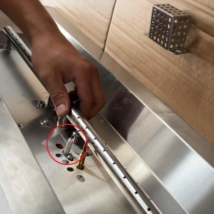 Starfire Designs Béton Fire Pit Spark Probe installed near the burner assembly, highlighting correct probe placement for consistent spark ignition.