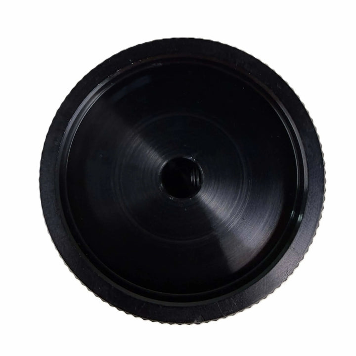 Close-up of the Starfire Designs Béton Fire Pit Replacement Valve Knob, showing the back view of the sleek black metal control knob with a precision center bore.