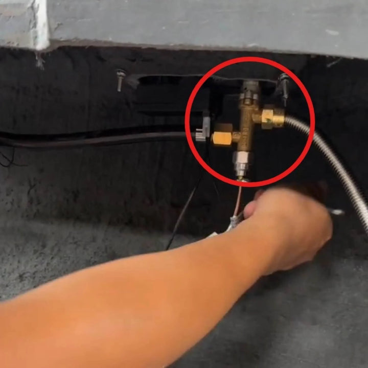 Starfire Designs Béton Fire Pit Replacement Propane Valve shown in use during installation, connecting brass fittings and flexible gas lines for safe and efficient fire pit operation.