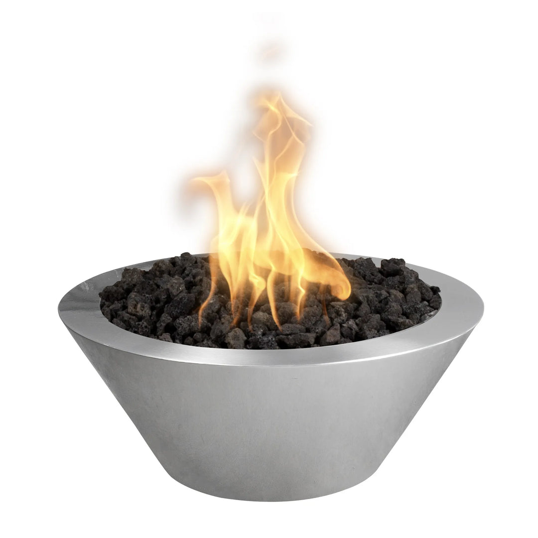 Polished stainless steel Cazo fire bowl with a tapered round design, showcasing vivid golden flames dancing above black lava rocks for luxury patio spaces.