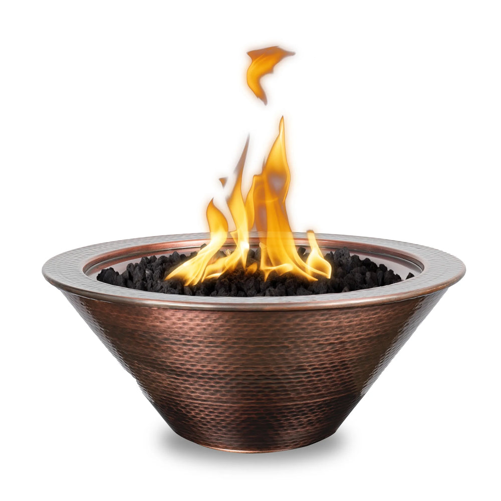 Elegant Cazo fire bowl crafted from hammered copper, beautifully ignited with clean, vibrant flames. Designed for modern outdoor settings, this decorative gas fire bowl combines luxury style with durable performance.