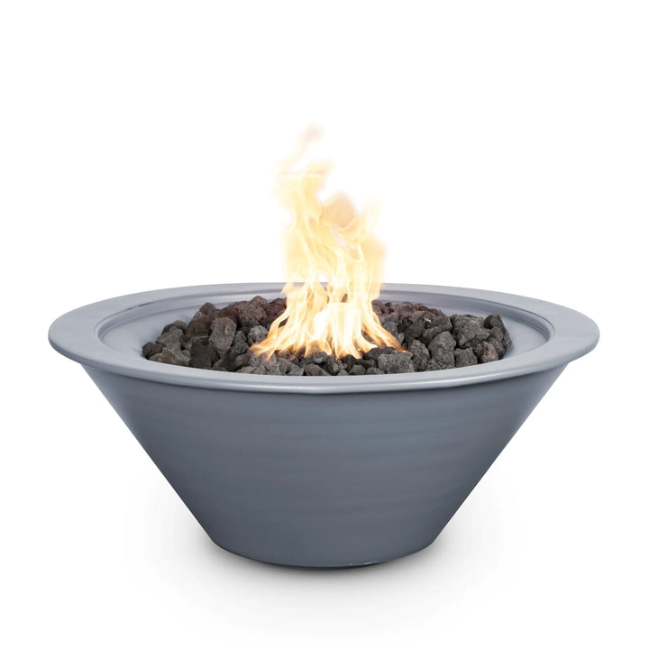 Modern and minimalist, this gray powder-coated Cazo fire bowl combines a soft matte finish with a sleek tapered profile, delivering a striking contrast to the fiery glow above natural black lava rocks.