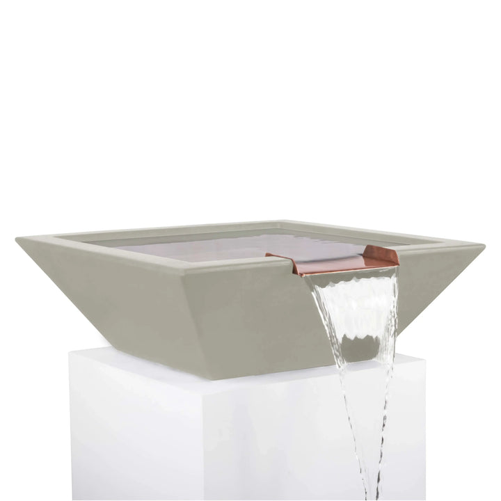 Contemporary ash-colored Maya Water Bowl with sharp square edges and copper spillway, designed to create a calming outdoor water feature.