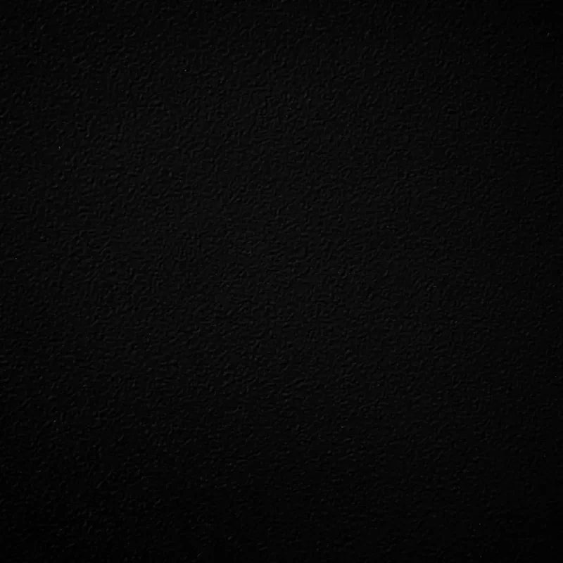 Matte black powder-coated metal swatch with a subtly textured finish, providing bold contrast and timeless sophistication for outdoor fire pits and bowls.