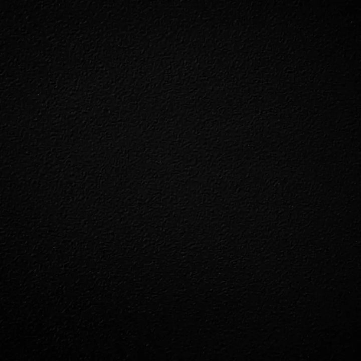 Matte black powder-coated metal swatch with a subtly textured finish, providing bold contrast and timeless sophistication for outdoor fire pits and bowls.