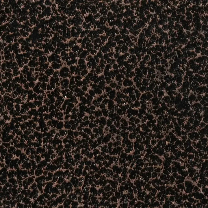 Detailed swatch of The Outdoor Plus Copper Vein powder-coated metal, featuring a rich, speckled black and bronze texture that adds depth and industrial charm to outdoor decor.
