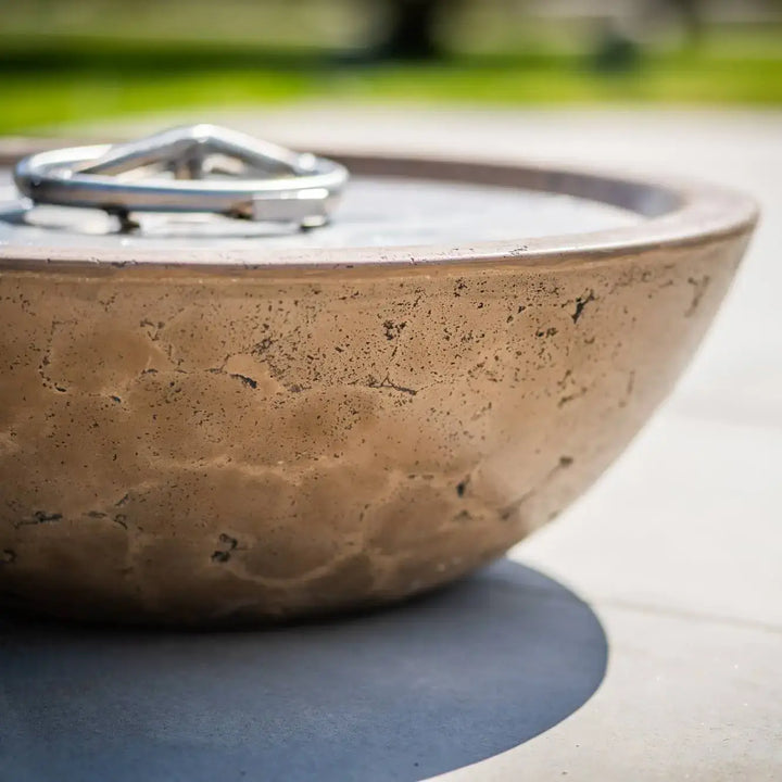 Close-up view of the Sedona Fire Bowl in Rustic Coffee finish showcasing its smooth, handcrafted texture and durable concrete surface under the sun.