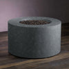 Beton 42-inch Graphite Round Concrete Gas Fire Pit with Access Door, shown without flames to emphasize its sleek modern design. The cylindrical shape and graphite color offer a minimalist look, blending seamlessly into any outdoor patio setup. The access door provides functionality for easy propane tank changes or maintenance