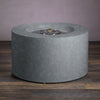 Beton 42-inch Graphite Round Concrete Gas Fire Pit with Access Door, featuring an open stainless steel burner system. The high-quality burner ensures even distribution of heat, making this fire pit ideal for outdoor gatherings. The access door allows for concealed propane tank storage, enhancing the clean, modern design