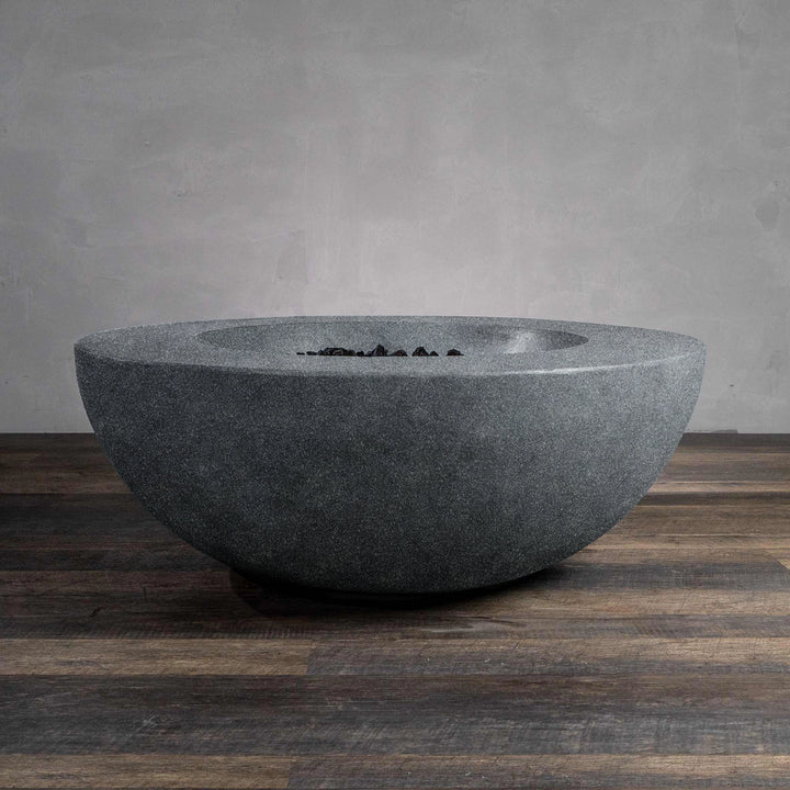 Image showing the Beton 42" Graphite Round Concrete Natural Gas Fire Pit in an unlit state, highlighting the smooth concrete bowl and empty fire pit interior. The durable graphite finish complements outdoor settings, offering a stylish centerpiece even when not in use. Designed for lasting performance in various weather conditions.