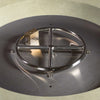 Close-up of the stainless steel burner inside the Beton 42-inch round concrete gas fire pit in sand color