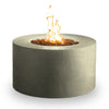 Lit flames inside the Beton 42-inch round concrete gas fire pit in sand color, creating a warm and inviting atmosphere in a white background silhouette 