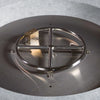 Detailed view of the stainless steel circular burner in the Beton 42-inch natural gray round concrete gas fire pit. This burner, surrounded by durable lava rocks, provides even flame distribution and efficient heat. The high-quality construction of the burner and the sleek design of the concrete fire pit make it a great addition for those looking for a natural gas fire pit for modern outdoor spaces