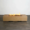 A studio view presents a rectangular concrete fire pit in a natural sand finish, contrasting against a dark wood floor and white background. Bright orange flames rise continuously from a bed of black lava rocks along the length of the linear fire pit, demonstrating the clean, smoke-free combustion. The minimalist presentation emphasizes the smooth texture and steady flame height typical of a high-quality natural gas fire pit connection.
