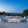 A crisp white concrete fire pit anchors a symmetrical seating area on a tiled terrace overlooking a sprawling city at twilight. Four modern armchairs surround the rectangular fire pit, establishing a sophisticated spot for outdoor entertaining next to an infinity pool. Steady flames rise from the center, casting a warm glow that emphasizes the sleek design and high-end atmosphere of this luxury fire pit setting.