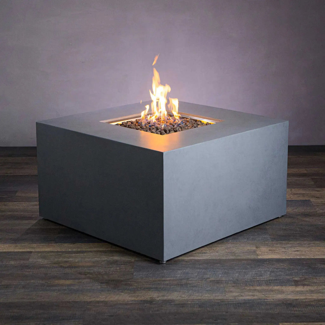 Starfire Designs Beton 42" square outdoor fire pit in natural gray, showcasing a modern concrete style with a hidden propane tank and vibrant flames, ideal for enhancing backyard spaces