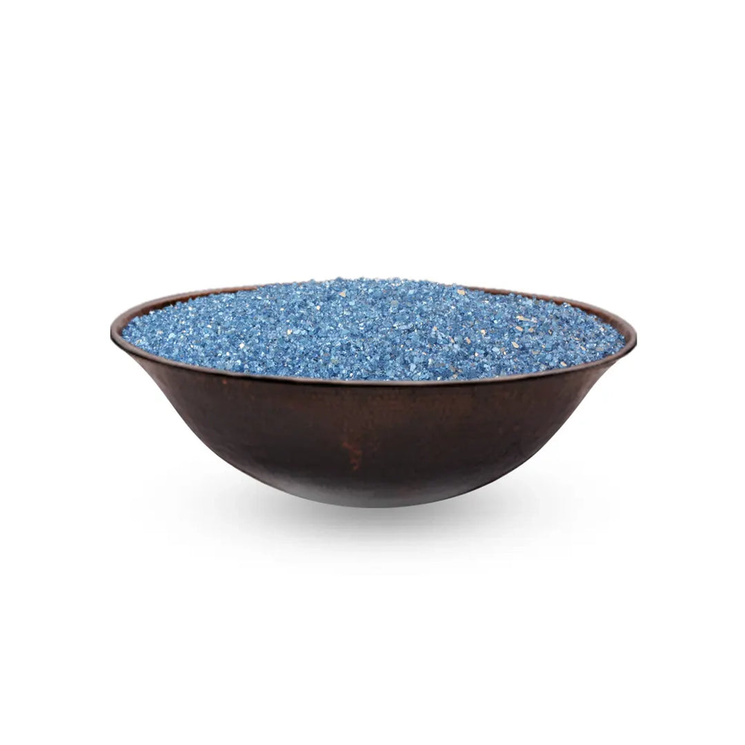 Round copper bowl fire pit with a deep, smooth design, filled with blue fire glass, ideal for modern outdoor spaces.