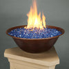 Campana Moreno 31-inch round copper fire bowl by Starfire Designs, featuring a vibrant blue fire glass bed, perfect for enhancing outdoor spaces with a modern copper finish and dynamic flame display