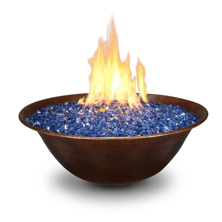 Campana Moreno 31-inch round copper fire bowl by Starfire Designs filled with vibrant blue fire glass, showcasing a modern and elegant outdoor fire pit design