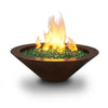 Cono Moreno 31-inch Round Copper Fire Bowl by Starfire Designs with green fire glass and a vibrant flame, ideal for enhancing any outdoor modern fire pit setting