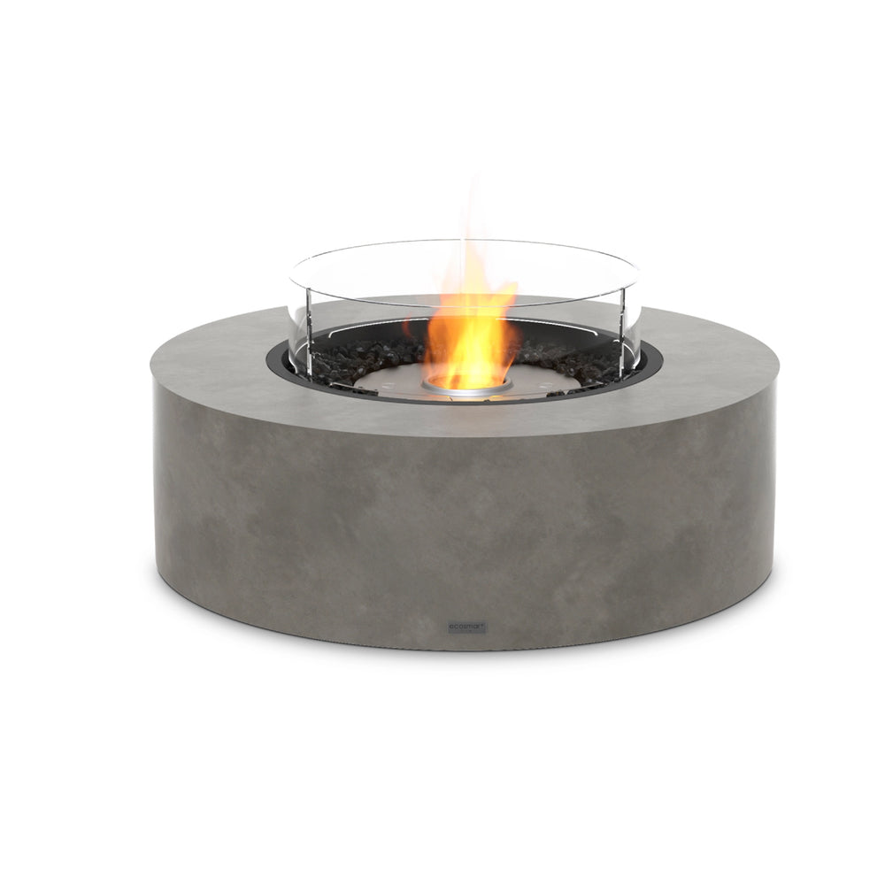 This EcoSmart Fire Ark 40 Natural Outdoor Fire Pit features a stainless steel burner with a glass wind guard, delivering enhanced flame protection and a modern design for luxurious backyard and patio spaces.