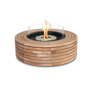 The EcoSmart Fire Ark 40 Teak fire pit showcases a premium stainless steel ethanol burner, encased in a slatted teak wood frame with a round profile for a timeless look. A tempered glass wind guard enhances flame visibility while ensuring safety in breezy conditions. This elegant fire feature is a stylish and functional addition to patios, poolside lounges, and backyard settings.