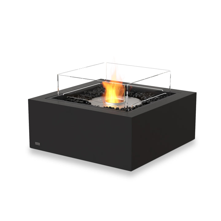 The EcoSmart Fire Base 30 Graphite ethanol fire pit, featuring a stainless steel burner with a glass wind guard, combines modern aesthetics with high-performance heat output. The graphite finish blends seamlessly into contemporary outdoor settings, while the eco-friendly ethanol burner ensures a smokeless and odorless flame for clean-burning enjoyment.