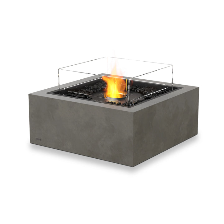  The EcoSmart Fire Base 30 in Natural features an ethanol black burner with a transparent wind guard, providing a sleek and modern fire pit for outdoor patios. Its concrete construction offers durability and weather resistance, while the wind guard ensures a steady flame, making it perfect for luxury outdoor fire pits and modern fire pit tables.