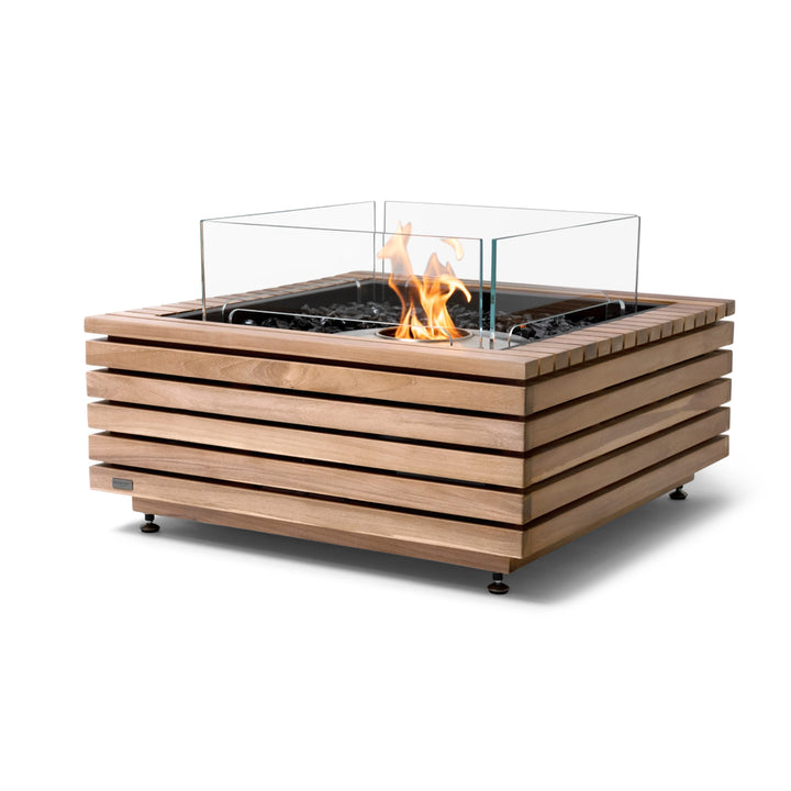 The EcoSmart Fire Base 30 Teak fire pit showcases a premium slatted teakwood body with an ethanol stainless steel burner and a protective tempered glass wind guard. The sleek design combines modern fire pit aesthetics with high functionality, making it a stunning outdoor fire table for contemporary patios. Its eco-friendly ethanol burner provides clean, smoke-free flames, perfect for social gatherings.