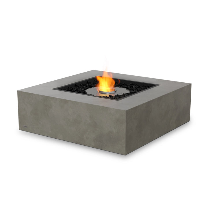 The EcoSmart Fire Base 40 Natural propane fire table with a stainless steel ethanol burner and tempered glass wind guard ensures a secure and elegant backyard fire pit experience. Featuring clean-burning ethanol, this square gas fire pit provides a modern touch to any patio or outdoor seating area.