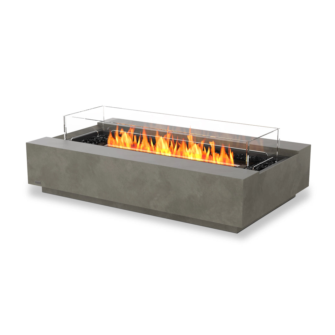 The EcoSmart Fire Cosmo 50 Natural rectangular gas fire pit features a sleek, modern concrete base in natural finish with a black burner and a glass wind guard. Designed for outdoor and patio use, this contemporary fire pit offers a clean-burning flame, making it a luxury addition to any backyard or commercial space.