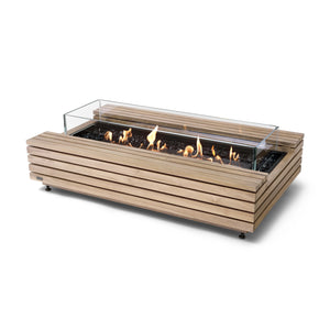 The EcoSmart Fire Cosmo 50 Teak rectangular gas fire pit features a durable teak wood slatted exterior with a black burner, protected by a tempered glass wind guard. This luxury outdoor fire pit runs on natural gas or propane and offers a contemporary design for patios and modern backyard spaces.