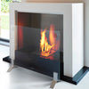 The EcoSmart Fire Plasma Glass Fire Screen is displayed in use, complementing a modern bioethanol fireplace. Featuring a transparent tempered glass panel with stylish stainless steel feet, this freestanding fire screen provides essential protection while maintaining an open, sophisticated aesthetic. Designed for safety and elegance, it enhances any contemporary indoor fireplace setting. fireplace safety screen, modern glass fire barrier, tempered glass fireplace guard, eco-friendly fire protection.