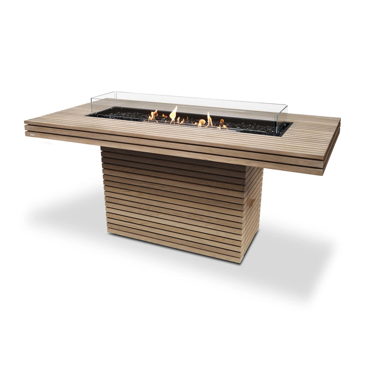 EcoSmart Fire Gin 90 (Bar) Teak with black burner and wind guard, a modern outdoor fire pit designed for elegant backyard spaces. This teak wood fire table features a linear burner with a protective glass wind guard, making it an ideal luxury fire pit for entertaining.