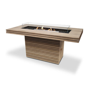 EcoSmart Fire Gin 90 (Bar) Teak with stainless steel burner and wind guard, offering a contemporary backyard fire table design. This teak gas fire pit blends natural aesthetics with modern functionality, perfect for upscale outdoor settings.