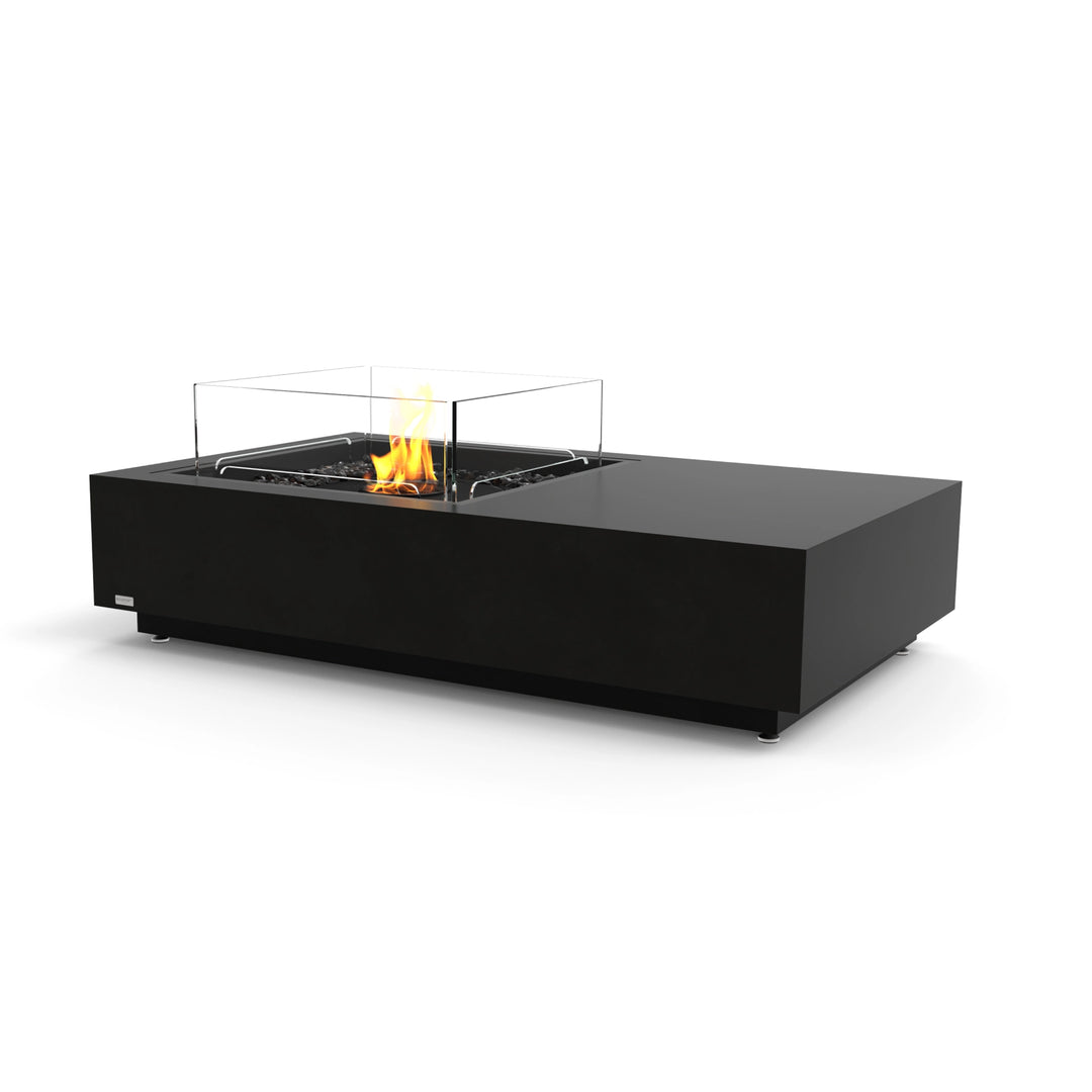 The EcoSmart Fire Manhattan 50 Graphite modern outdoor fire pit features a sleek graphite finish, a black burner, and a protective glass wind guard. This rectangular gas fire table blends style and functionality, making it a luxury fire pit for patio settings. The wind guard enhances flame stability, while the durable construction ensures long-lasting outdoor use.