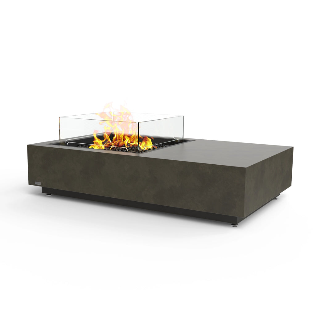 The EcoSmart Fire Manhattan 50 Natural is a premium outdoor propane fire pit in a natural concrete finish, featuring a black burner and a protective glass wind guard. This rectangular gas fire pit provides a sleek, modern aesthetic, making it an ideal choice for luxury patios, backyards, and commercial spaces. 