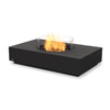 This EcoSmart Fire Martini 50 Graphite propane-powered fire pit is built with a protective glass wind guard for a steady flame and a graphite-finished rectangular concrete base. Its propane fuel compatibility makes it an excellent choice for residential patios, commercial fire pits, and high-end outdoor settings, ensuring a luxury fire table experience.