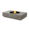 EcoSmart Fire Martini 50 Natural gas fire pit in a concrete-textured finish, featuring a black burner with a circular flame design. This modern outdoor fire pit blends contemporary aesthetics with functionality, making it perfect for luxury backyard gatherings. The natural gas fire bowl delivers clean-burning warmth, enhancing your patio's atmosphere.