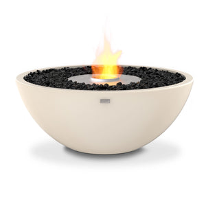 The EcoSmart Fire Mix 850 Bone Fire Pit showcases a smooth bone-colored concrete bowl with a stainless steel burner, enhanced by decorative black fire glass. This contemporary outdoor fire pit offers a stylish centerpiece for luxury backyard fire features, powered by clean-burning bioethanol fuel.