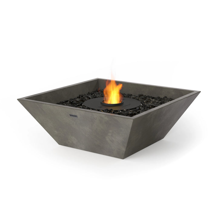 he EcoSmart Fire Nova 600 in Natural with Stainless Steel Burner features a natural concrete base, a stainless steel burner, and black fire glass for a modern fire pit table aesthetic. Ideal for luxury fire pits, commercial fire pits, and outdoor gas fire pits.