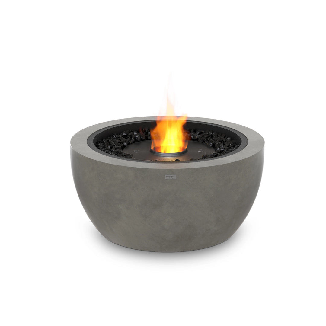 A EcoSmart Fire Pod 30 in natural with a black burner, providing warmth and ambiance as a modern outdoor fire pit.