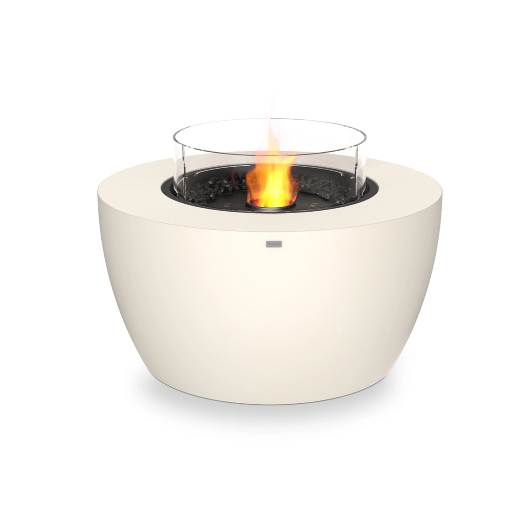 The EcoSmart Fire Pod 40 in bone finish with an ethanol black burner and glass wind guard, creating a modern outdoor fire pit experience. This round gas fire pit features durable concrete construction and clean-burning ethanol fuel, making it ideal for patios, backyards, or outdoor lounges.