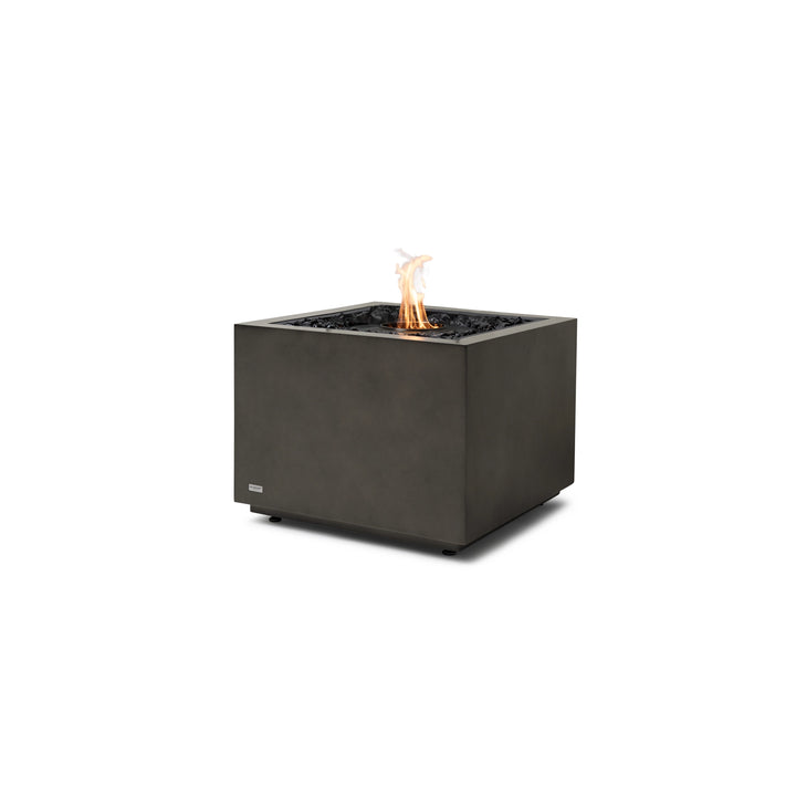 EcoSmart Fire Sidecar 24 fire pit in Natural finish with a black burner. This modern outdoor fire pit features a sleek cube design with a clean, smooth concrete surface. Fueled by natural gas or propane, it offers a smokeless, adjustable flame with black fire media for a sophisticated touch. A perfect centerpiece for contemporary patios and luxury outdoor spaces.