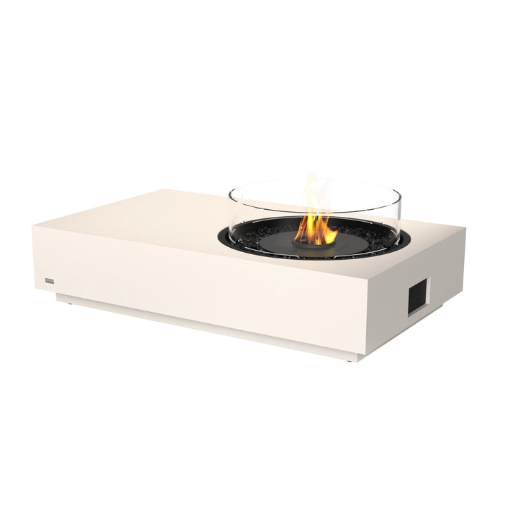 The EcoSmart Fire Tequila 50 Bone outdoor fire pit in bone finish, featuring a black burner with a circular glass wind guard for enhanced flame protection. This modern fire pit is designed for luxury outdoor spaces, offering a sleek and contemporary aesthetic while providing warmth and ambiance. Perfect for residential and commercial patios.